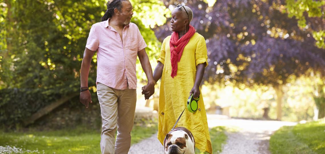 Man and Woman Walking Dog Man and Woman Walking Dog
