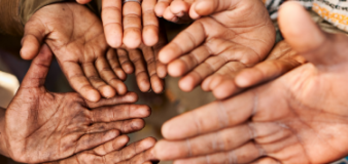 Group of hands outreached.
