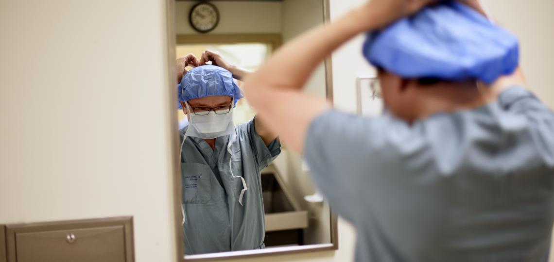 Dr. Ken Liao prepares for surgery.