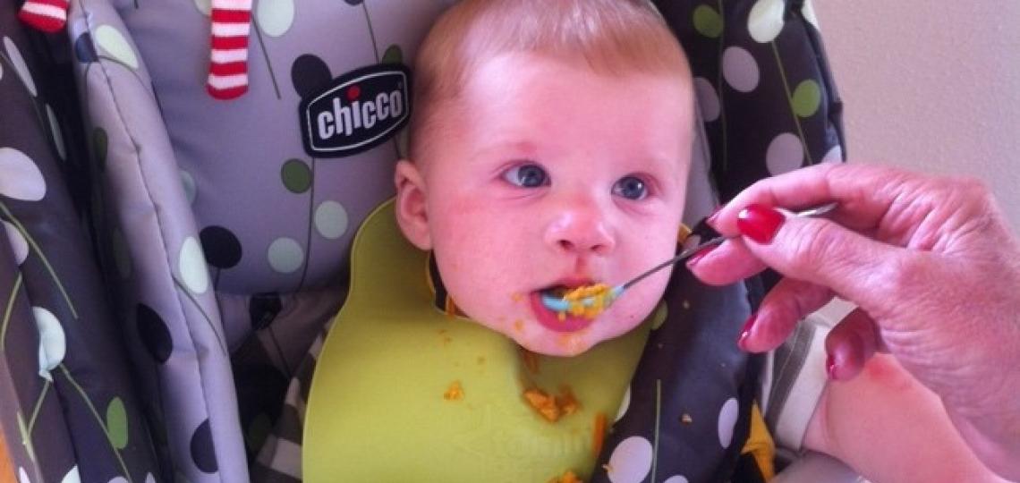 Infant being fed Infant being fed