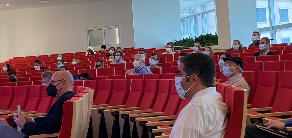 Audience members sitting in an auditorium during the 2022 Annual Pathology and Immunology Trainee Research Symposium 