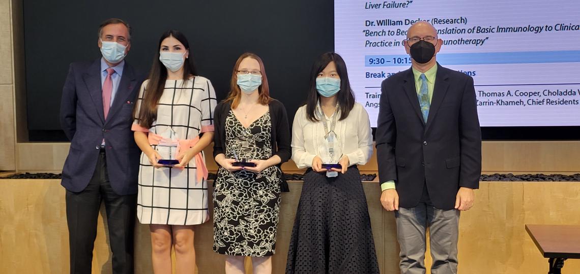 Oral presentation award winners Annie Garcia, Kelsey Hummel, Feiyan Mo receiving awards from Dr. James Versalovic and Dr. Martin Matzuk