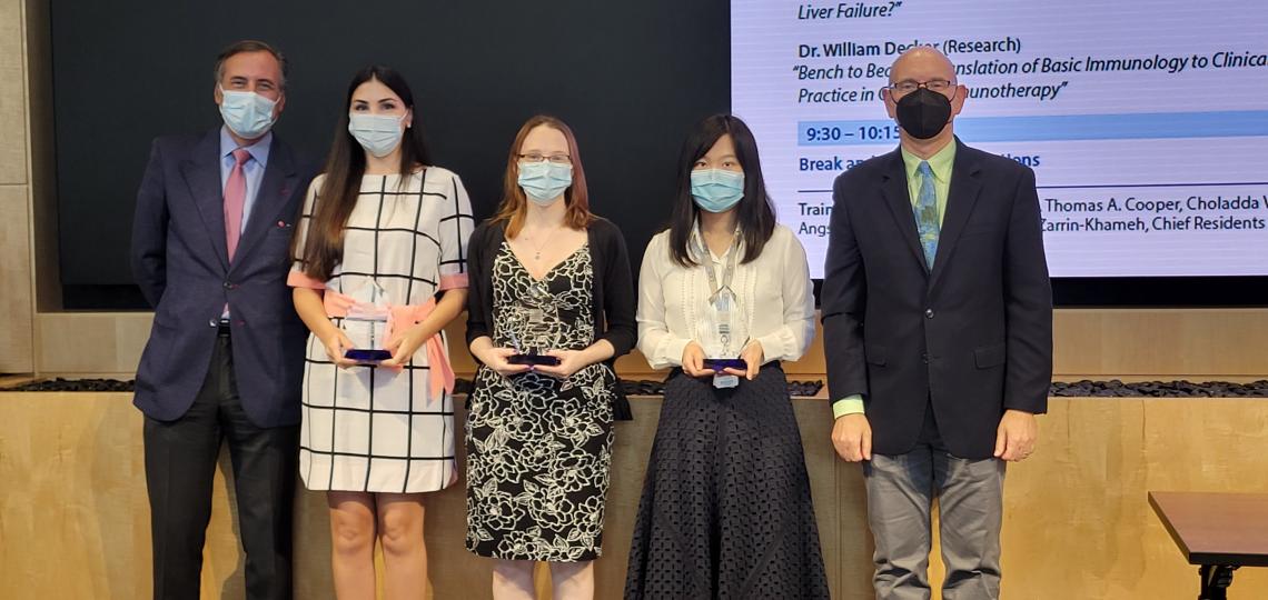 Oral presentation award winners  Annie Garcia, Kelsey Hummel, Feiyan Mo receiving awards from Dr. James Versalovic and Dr. Martin Matzuk