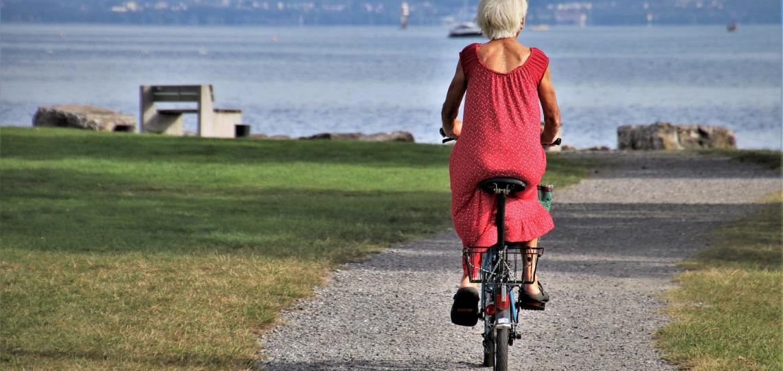 Elderly woman on bike