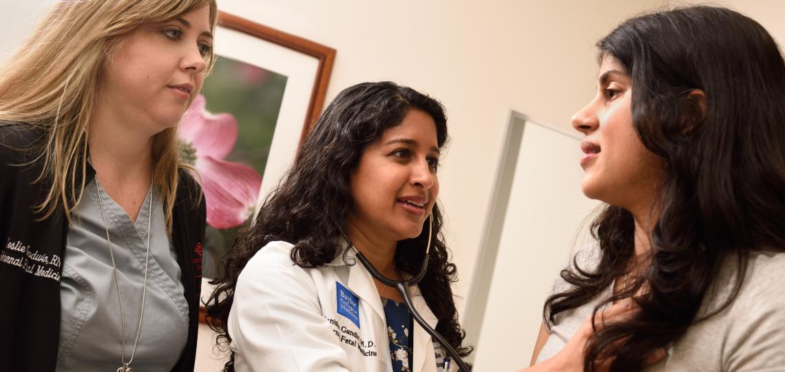 Manisha Gandhi MD, division director for Maternal Fetal Medicine at Baylor, examines a patient in the Maternal Fetal Medicine clinic.