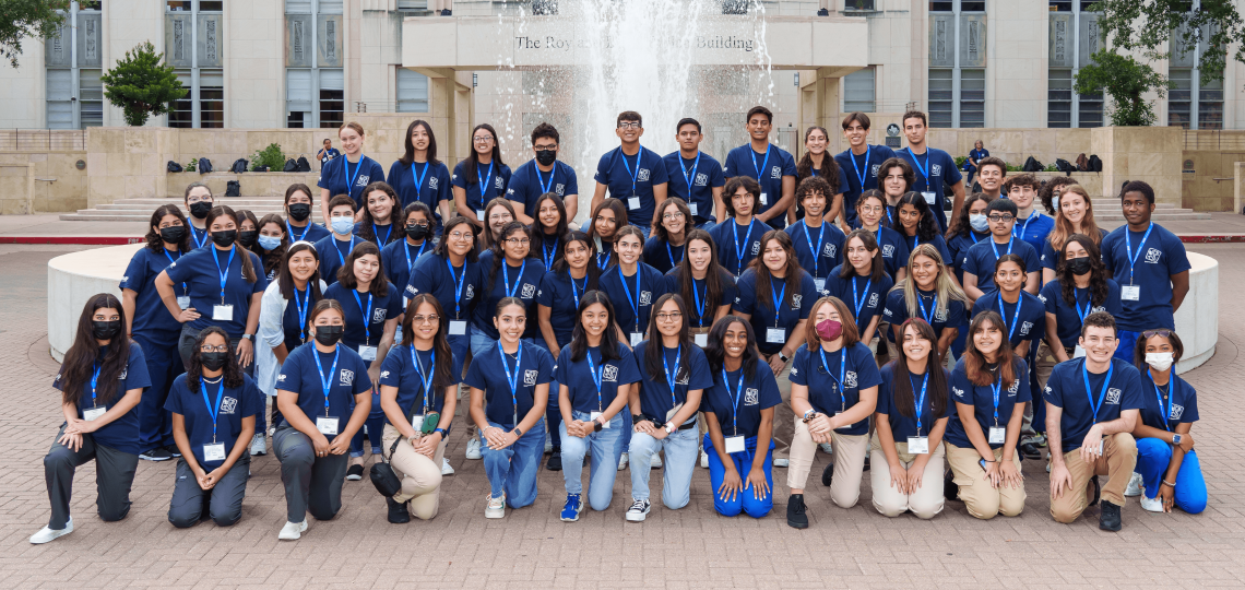 A large group of Doc Prep students stand outside Baylor.