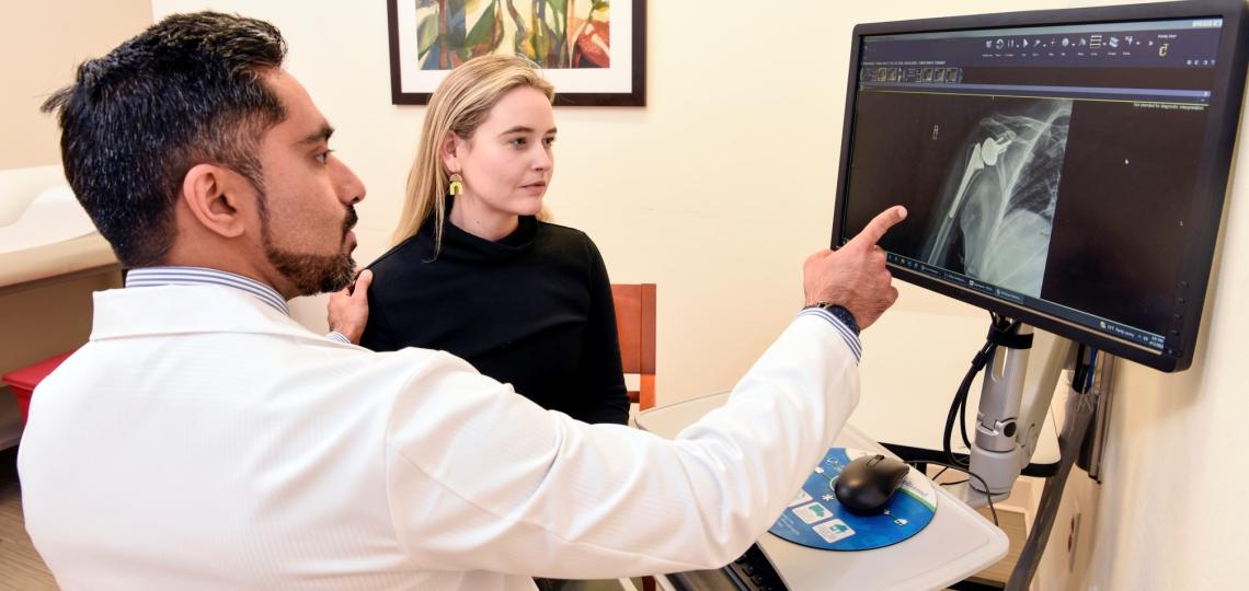 Doctor examining shoulder x-ray