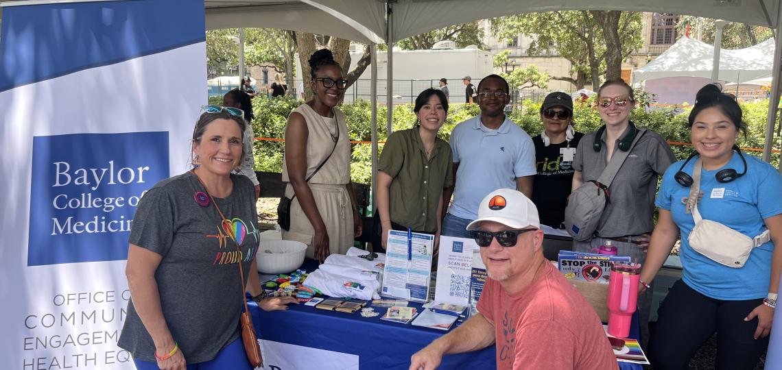 group of people at the Baylor College of Medicine booth in Pride 2024