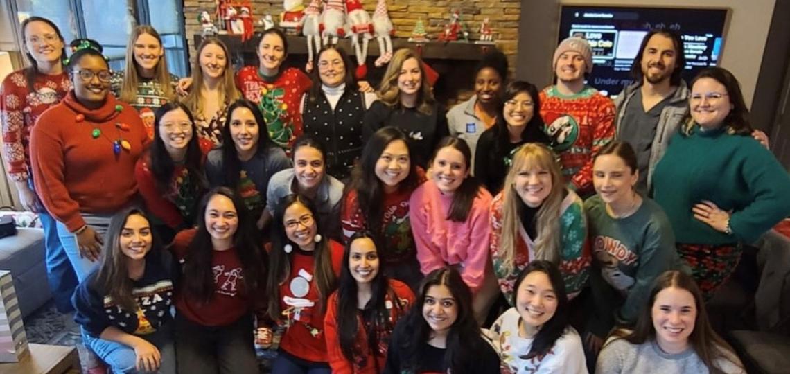 group of people in christmas attire smiling