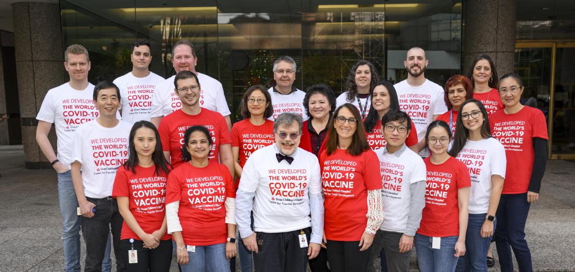 tropical medicine faculty members wearing red and white shirts, smiling