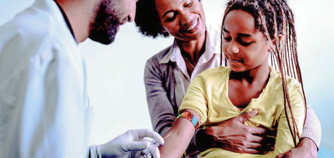 Child receiving blood draw Child receiving blood draw