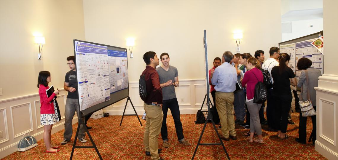 Students, postdocs and faculty during a poster presentation session