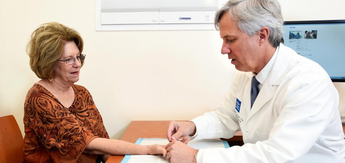Thomas Hunt, M.D., with orthopedic patient