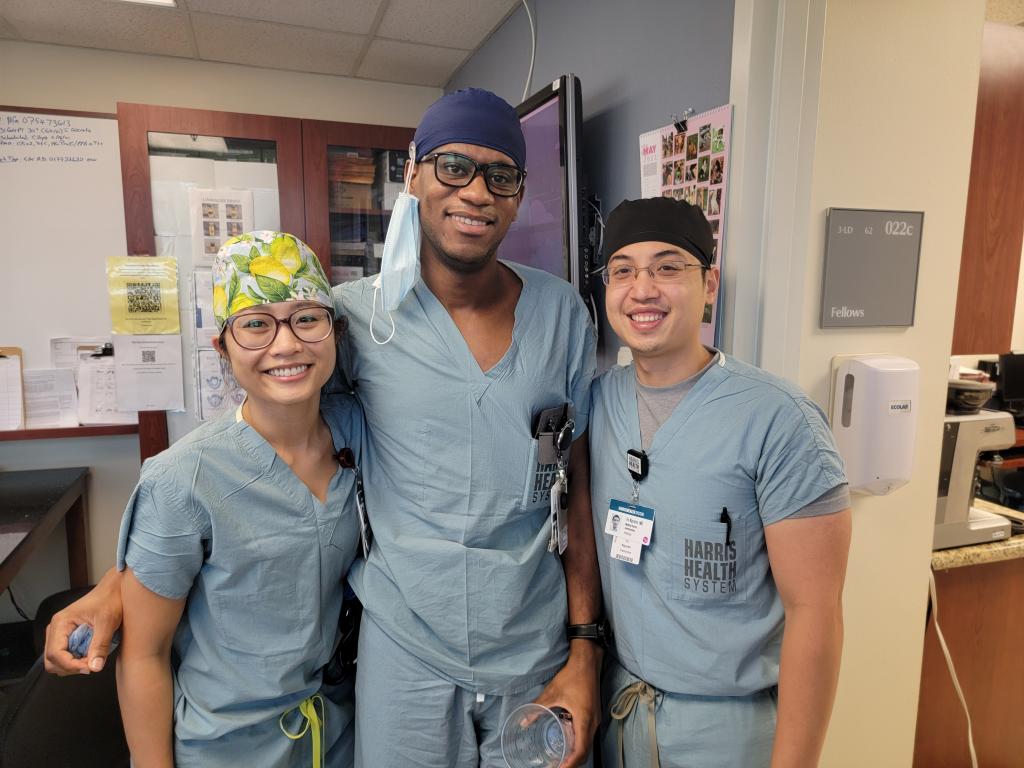 Residents Kelley Nguyen and Leshawn Richards celebrate  the successful management and resuscitation of a complex obstetric patient with their attending, Vu Nguyen.