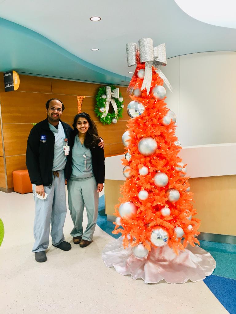 Residents, Drs. Bansal and Johny, get in the holiday spirit at the Texas Medical Center.