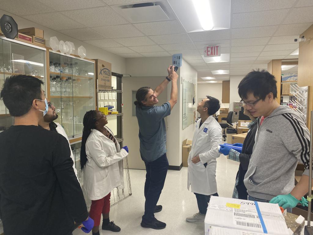 Dr. Mills and lab members working in the recently completed lab facilities.