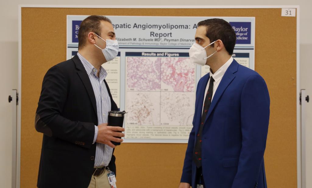 Participants of the 2022 Annual Pathology and Immunology Trainee Research Symposium mingle.