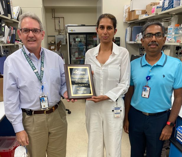 Former CTRID T32 trainee, Dr. Anaum Maqsood, receiving her graduation award from CTRID Director, Dr. Rolando Rumbaut, and her primary mentor, Dr. Vinod Vijayan.