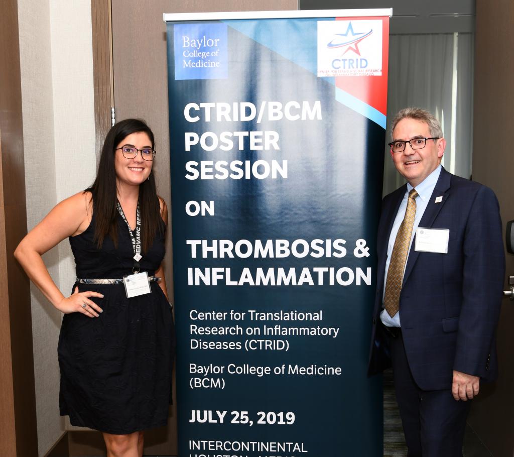 Christine Eriks and Dr. Rolando Rumbaut attending the 2019 Links between Thrombosis and Inflammation conference poster session.