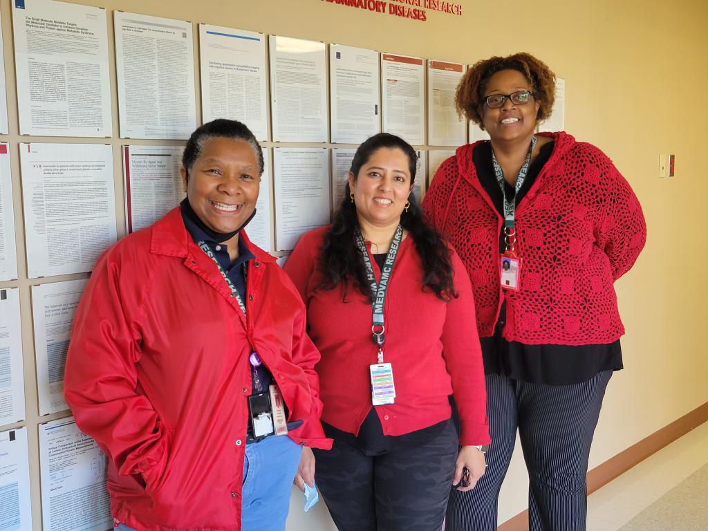 Kimberly Langlois, Anjali Raval, and Dorellyn Lee (left to right) 'Go Red' on National Wear Red Day for the American Heart Association's Go Red for Women campaign to raise awareness about cardiovascular disease in women.