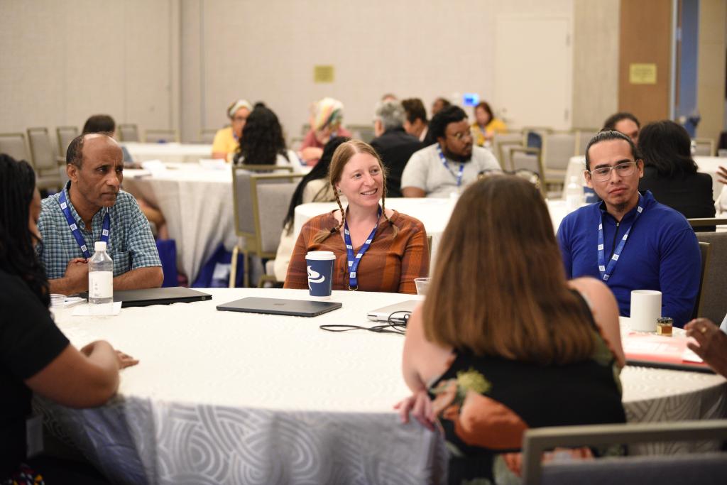 Scholars forming research teams at the Biomedical Researcher Faculty Summit