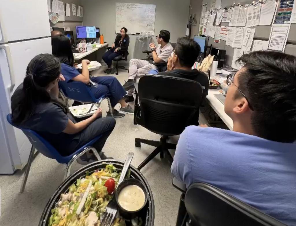 Students eating lunch together in the lab