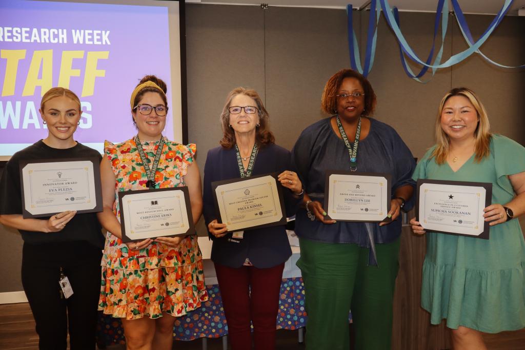 Awardees at the 2024 Research Service Line Staff Party for National VA Research Week. From left to right: Eva Milstead, Christine Eriks, Paula Kinsel, Dorellyn Lee, and Supicha Sookanan.