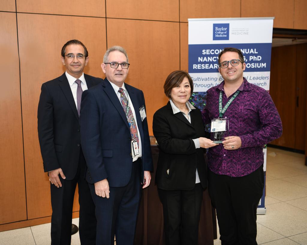Caption: CTRID T32 trainee Dr. Justin Courson winning second place in the Second Annual Nancy Chang, PhD Research Symposium poster session, presented to him by Dr. Hashem El-Serag, Dr. Rolando Rumbaut, and Dr. Nancy Chang (left to right).