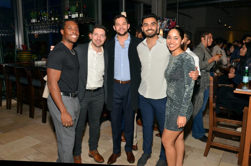 small group of people smiling at a nice event