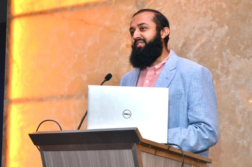 man speaking at podium