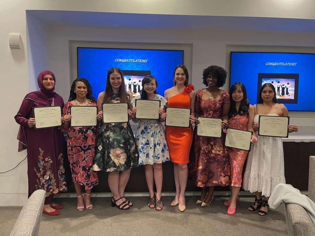 group of resident holding up awards