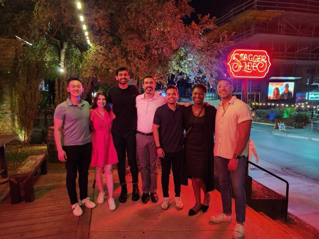 group of people smiling and standing together