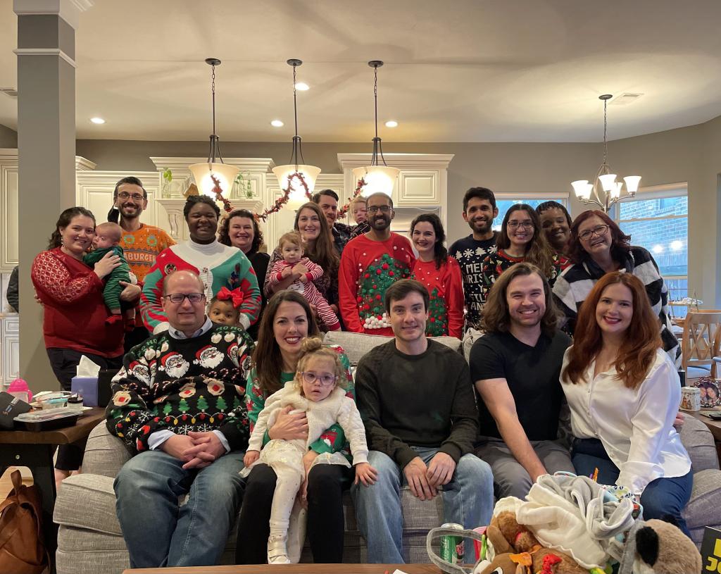 residents dressed in holiday attire smiling