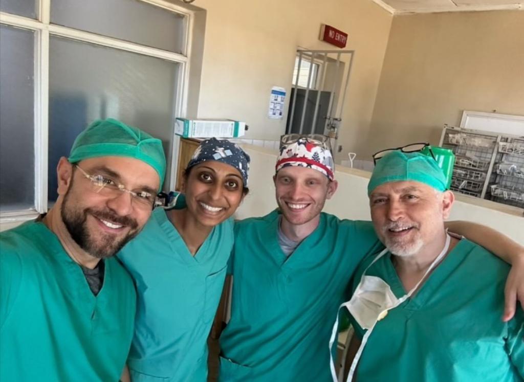 4 global health doctors smiling