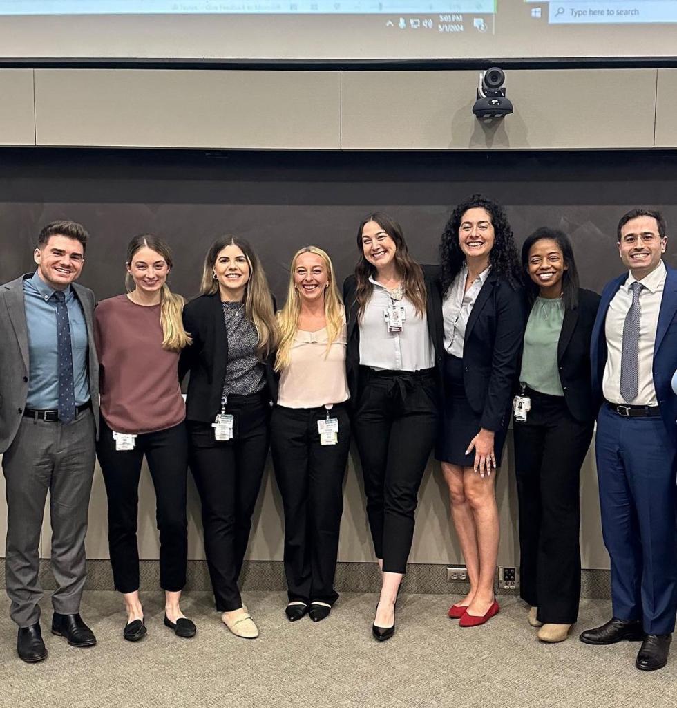 group of people dressed professional smiling