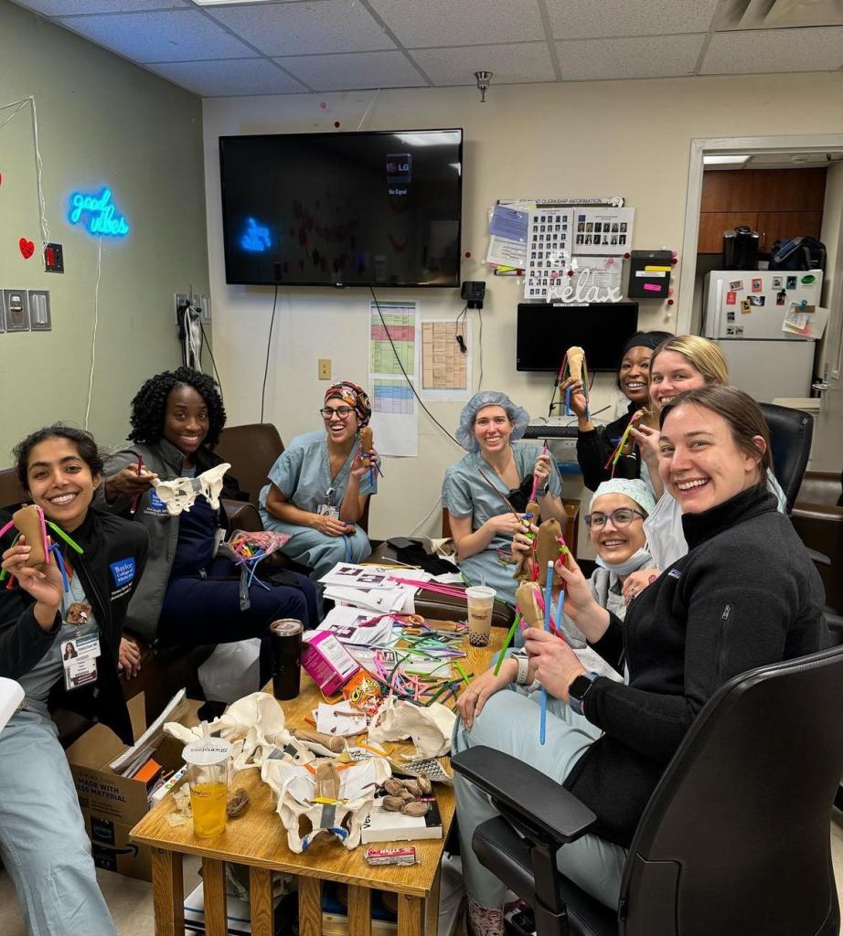 ob/gyn residents building things together at a table