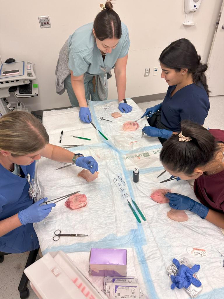 ob/gyn residents performing a minor surgery simulation