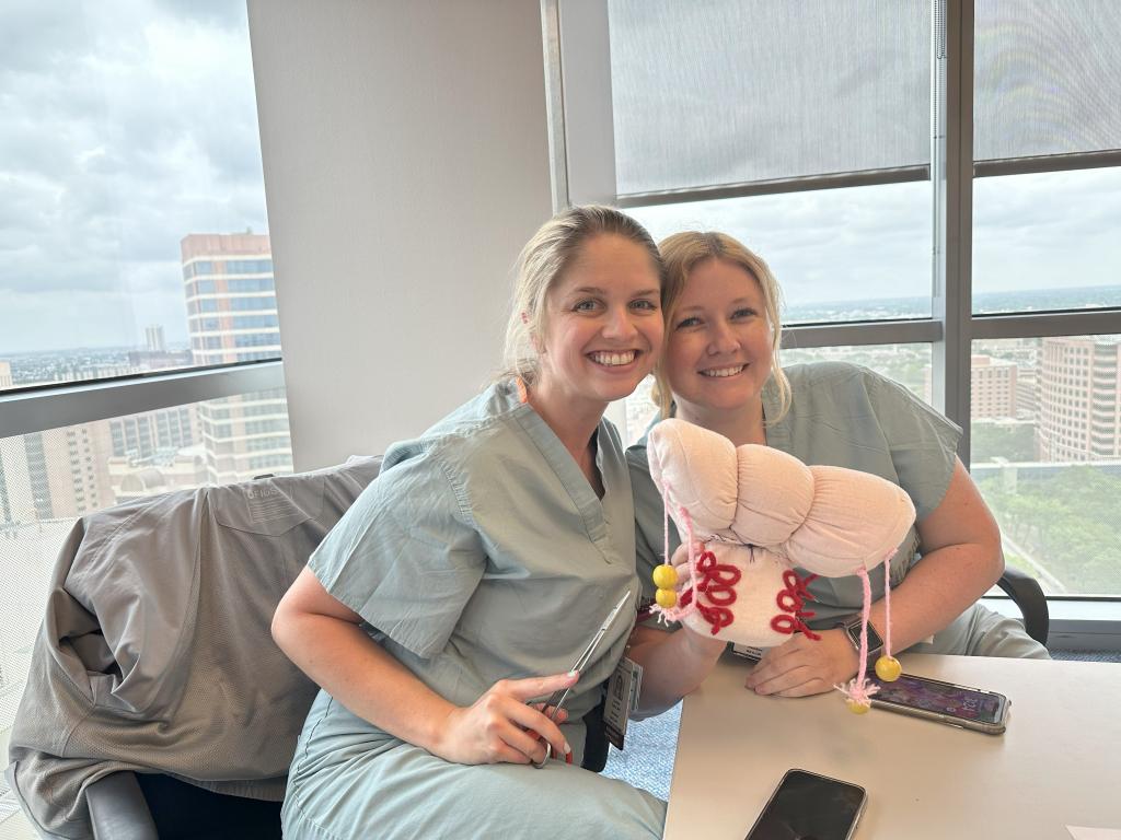 Two OB/GYN residents smiling