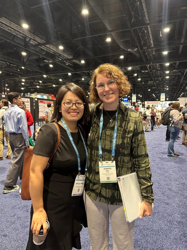 two women standing at an event at the 2024 SfN