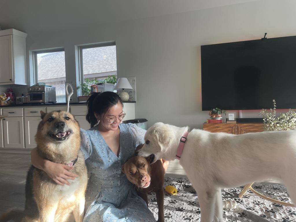 a woman with two pets