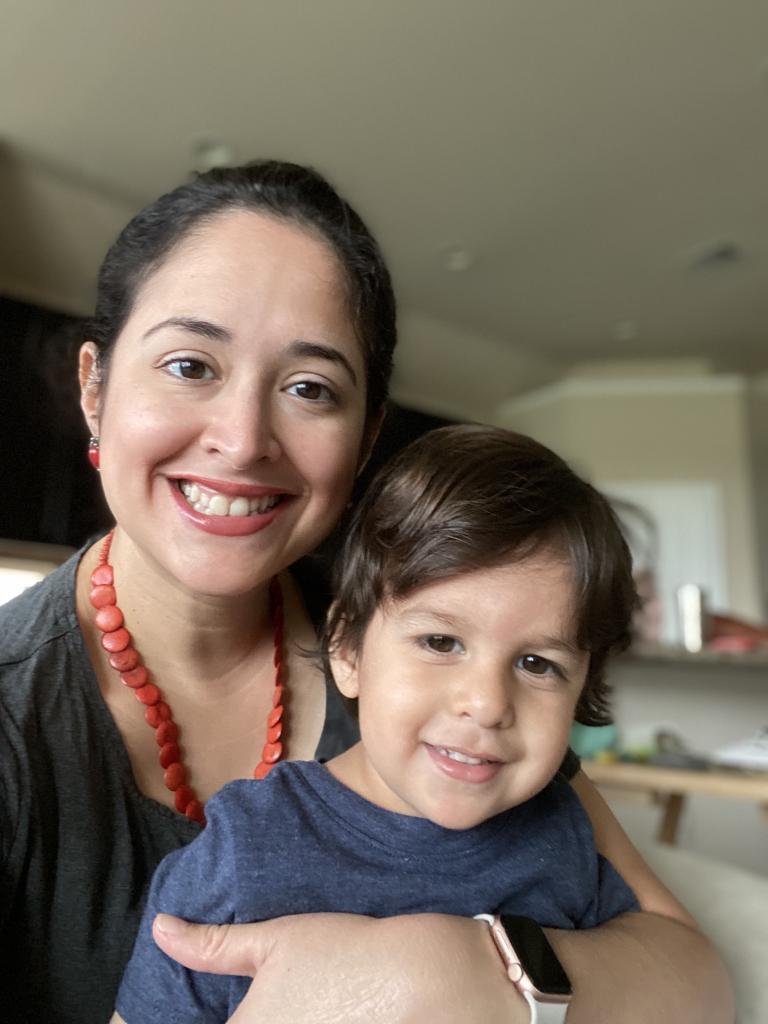 a woman and her child smiling