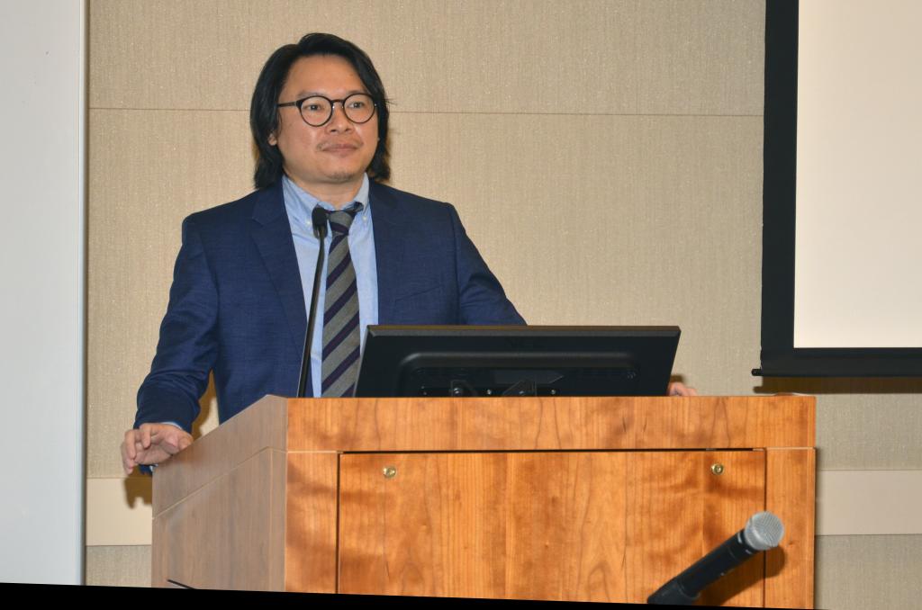 man speaking at a podium