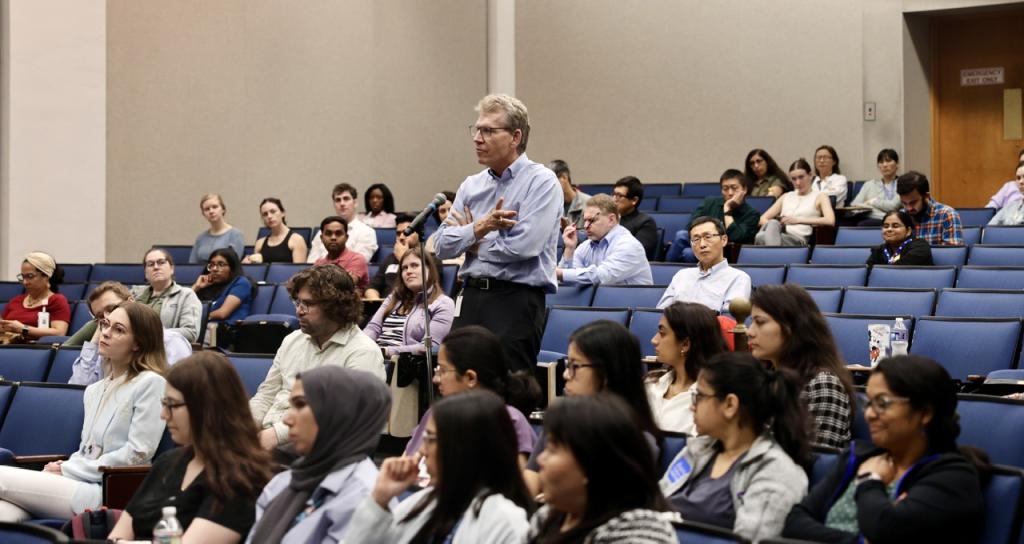 group of people sitting in an auditorium