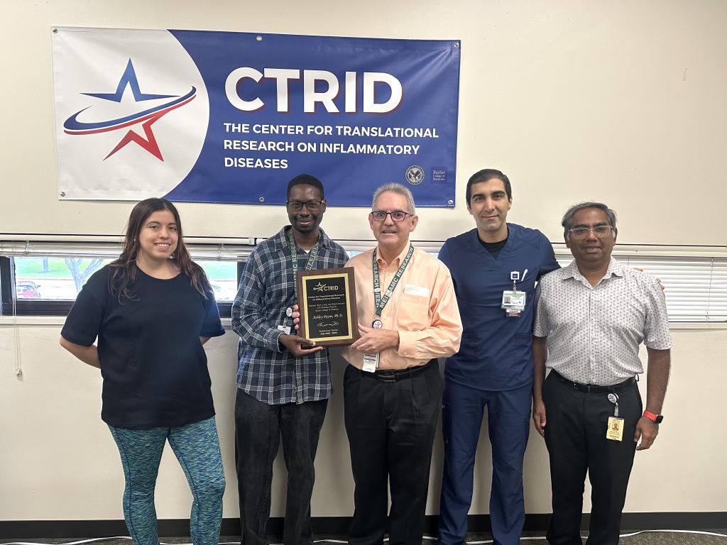 AY25 T32 Graduation Session. Graduate: Dr. Ashley Payne. Left to right: Drs. Andrea Salinas, Ashley Payne, Rolando Rumbaut, Mohammad “Mo” Saadatagah, and Vinod Vijayan.