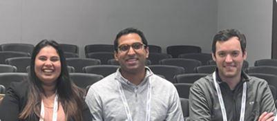 3 people sitting together smiling