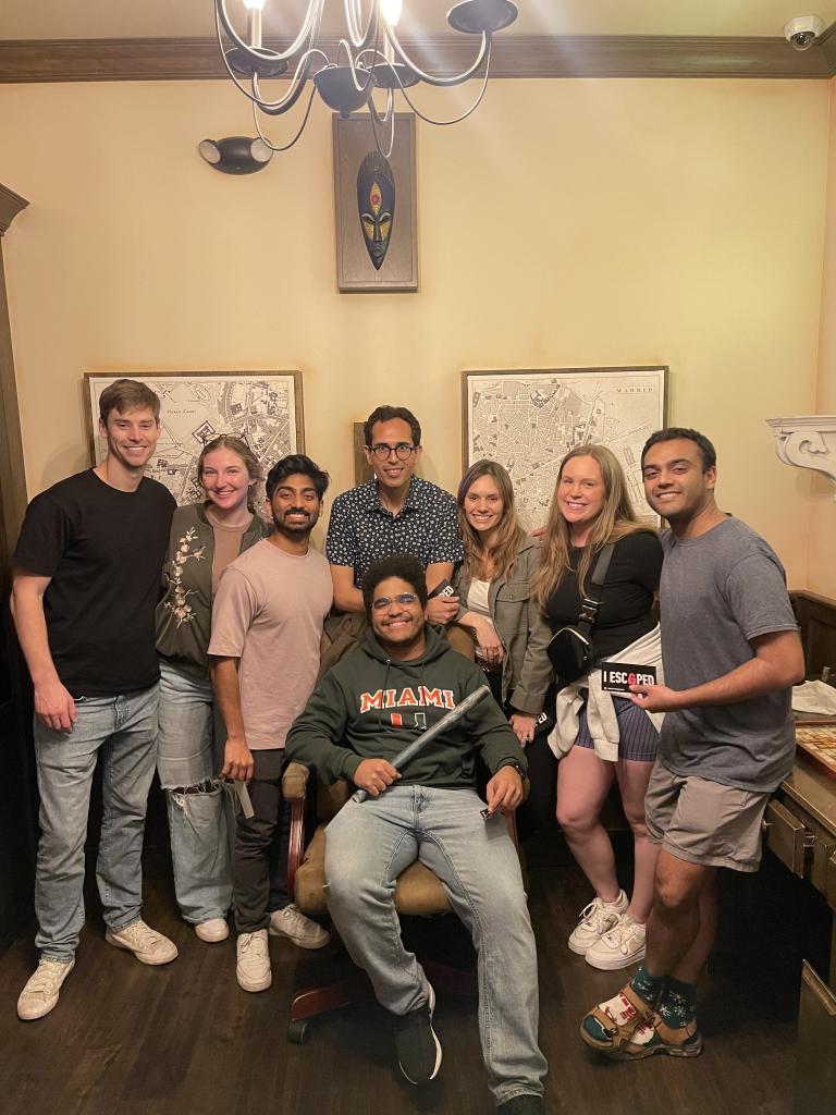 people smiling inside a house