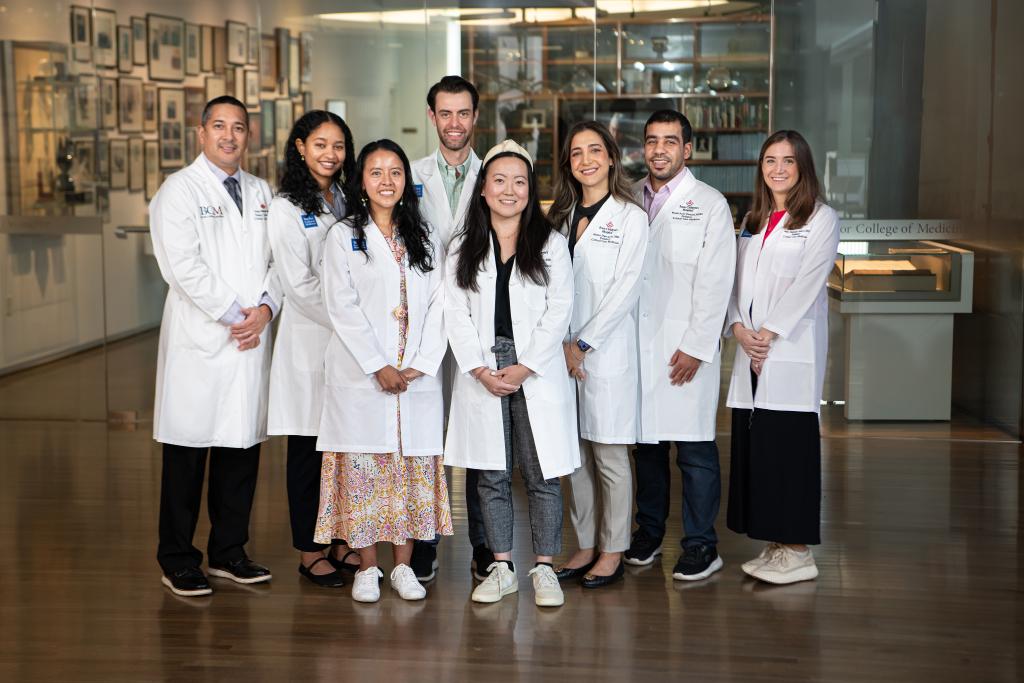 a group of doctors standing together smiling