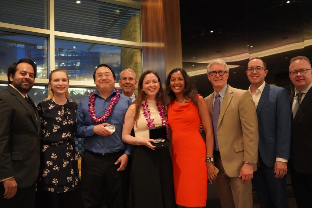 a group of people dressed nicely, smiling