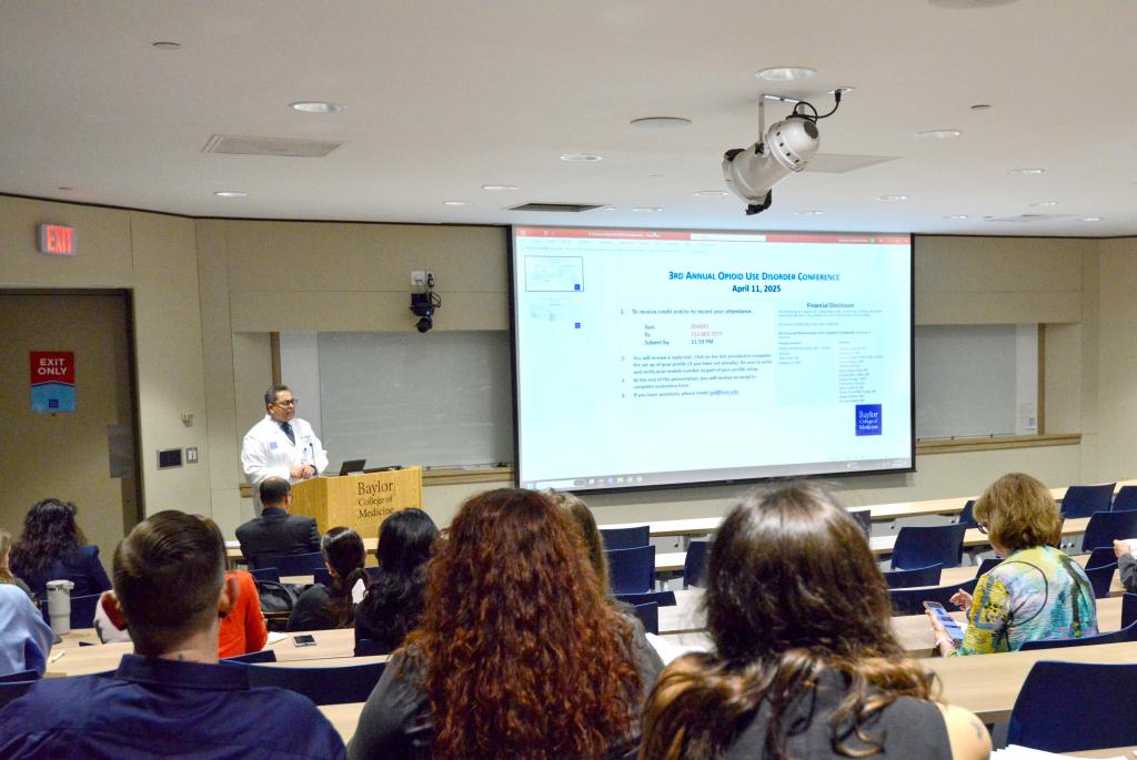 A seated group watching a presentation