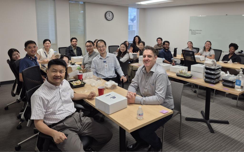 a large group of people enjoying thanksgiving dinner